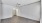 a room with white walls and a wood floor