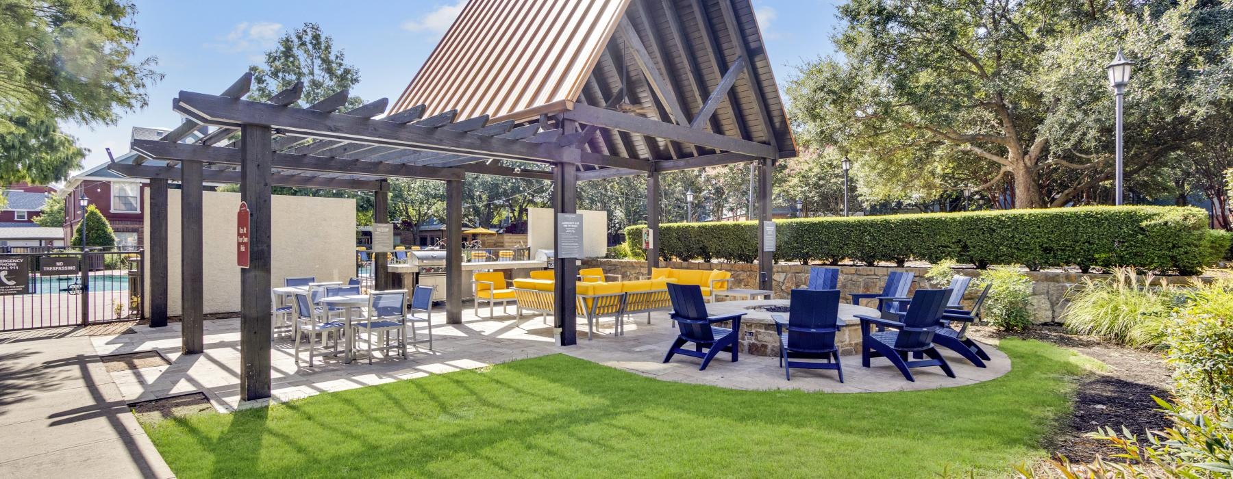 a covered area with tables and chairs