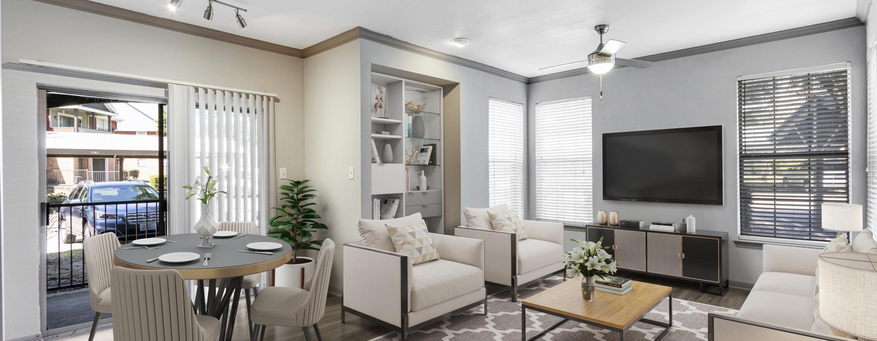 a living room with a tv and couches