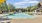 a pool with chairs around it
